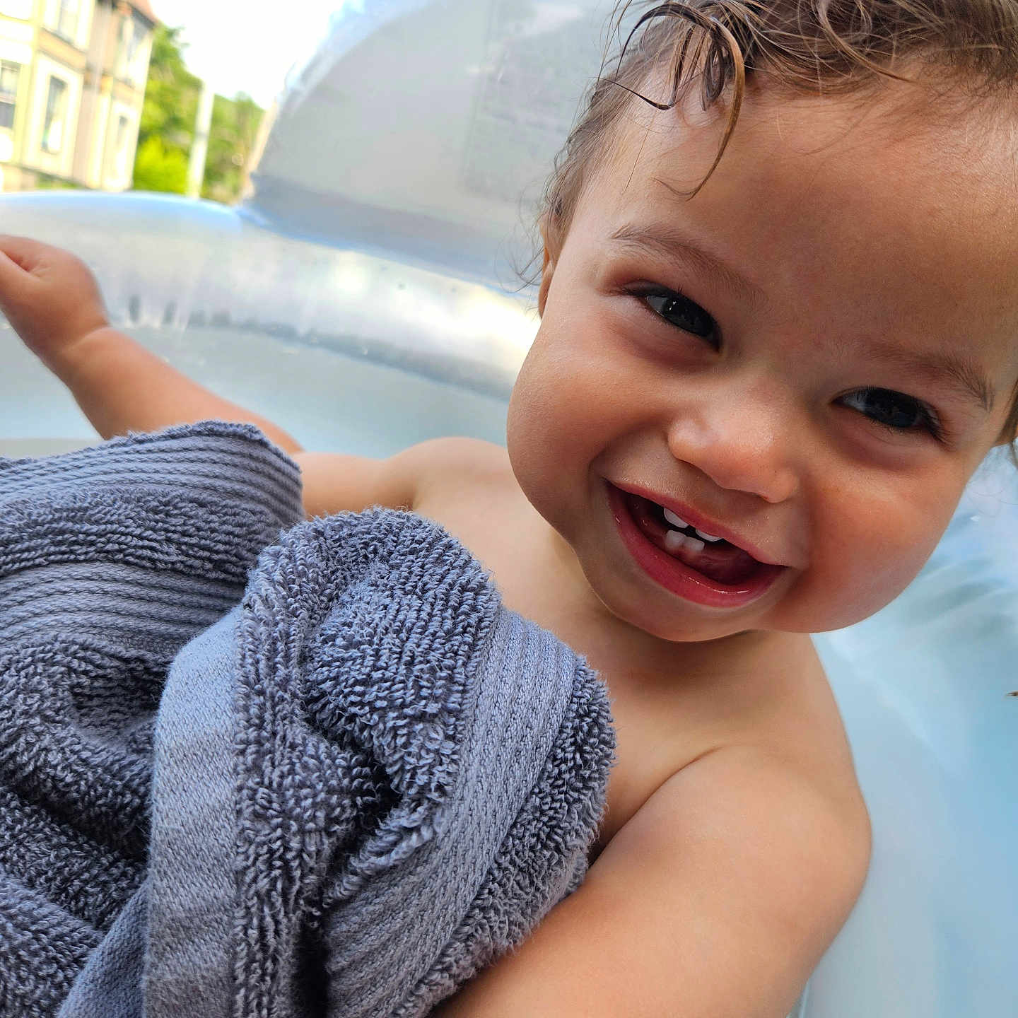 Amari is registered to the contest to win money with this photo: toddler, child, smiling, face, towel, water, pool, outdoor, happy, skin, hair, person, summer, relaxing, sunlight, baby, expression, cute, closeup, nature