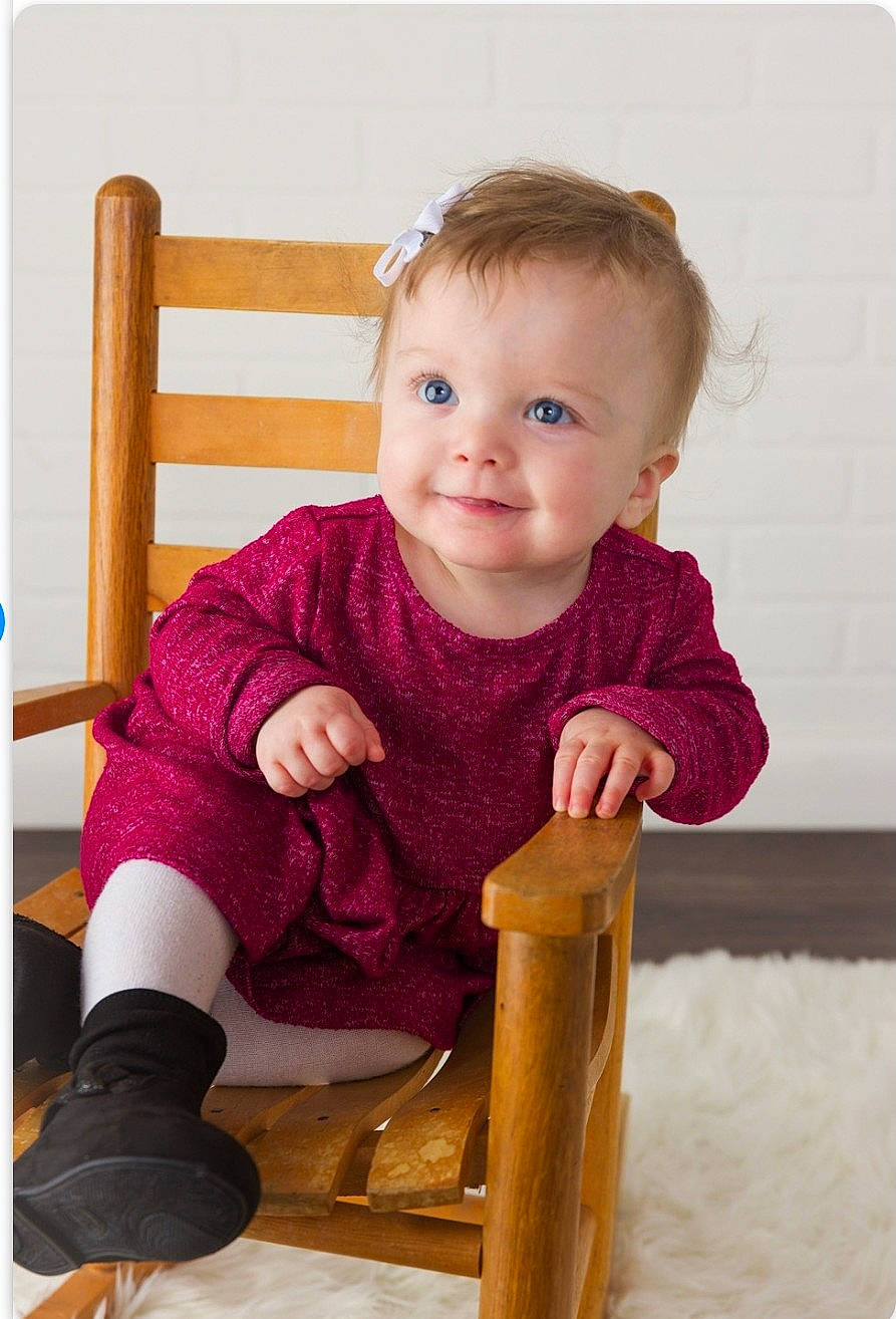 Azilynn is registered to the contest to win money with this photo: baby, baby_products, baby_toddler_clothing, beauty, chair, cheek, child, comfort, fun, happy, human_body, joy, magenta, pattern, person, play, sitting, skin, sleeve, smile