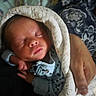 Kaden is registered to the contest to win money with this photo: newborn, baby, sleeping, blanket, hand, infant, wrapped, cozy, soft, portrait, person, resting, cute, clothing, peaceful, closeup, skin, face, young, comfort