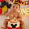 Oakley joined the competition — help win amazing prizes! baby, birthday, cake, cake_smash, crown, red, white, yellow, balloons, celebration, crumbs, frosting, messy, one_year, child, smash_cake, floor, happy, party, cute