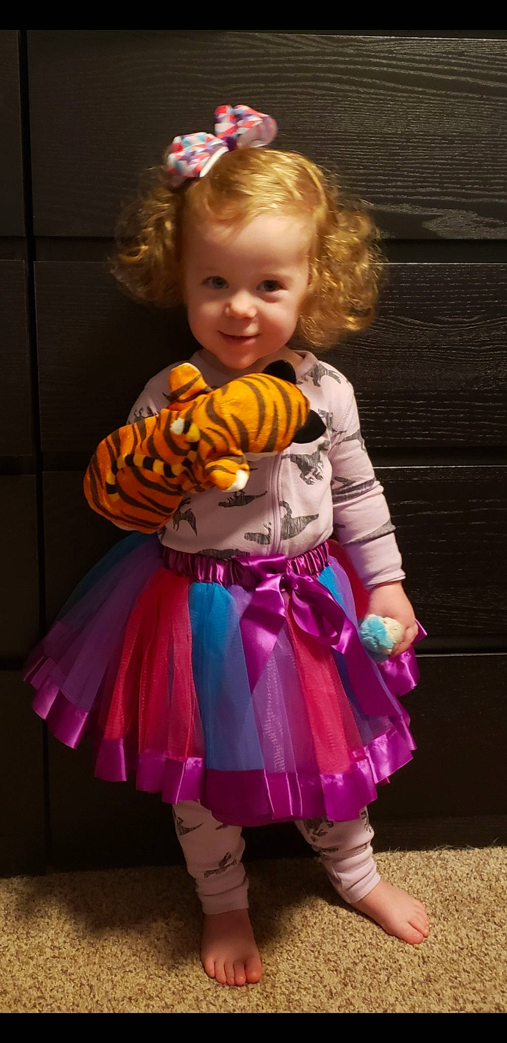 Merida is registered to the contest to win money with this photo: child, child_model, clothing, costume, joy, person, pink, toddler