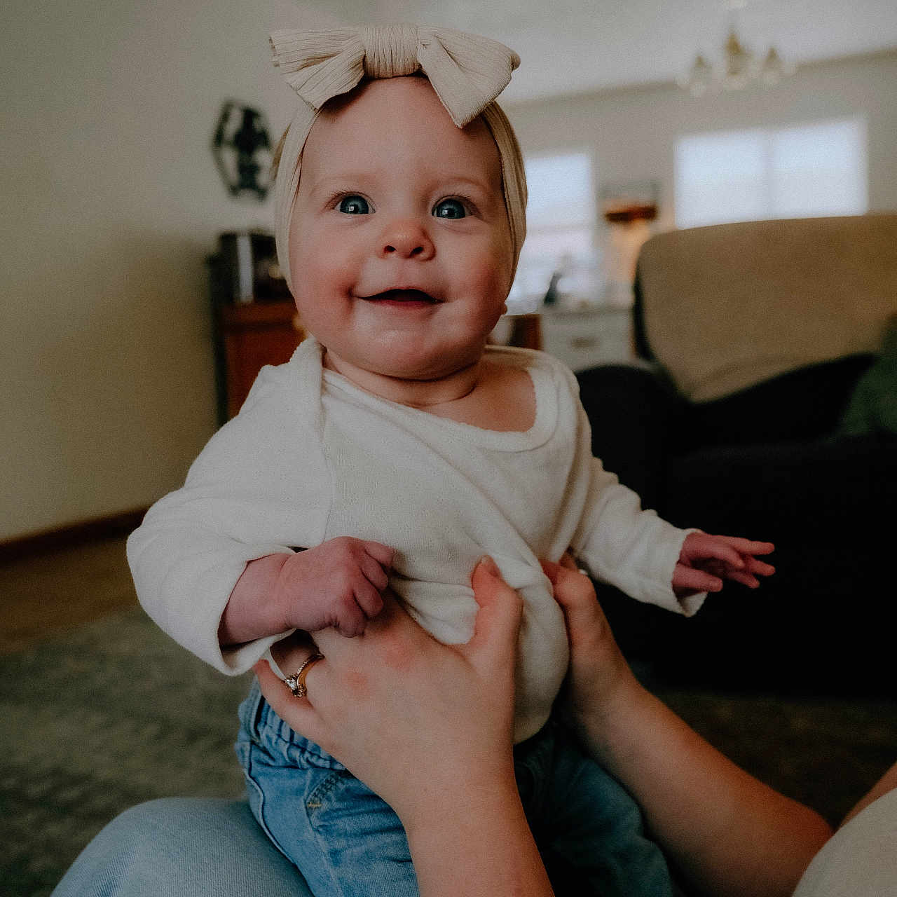 Adelyne joined the competition — help win amazing prizes! architecture, baby, bodypart, building, clothing, couch, face, finger, furniture, hand, happy, head, indoors, jeans, pants, person, photography, portrait, sitting, smile