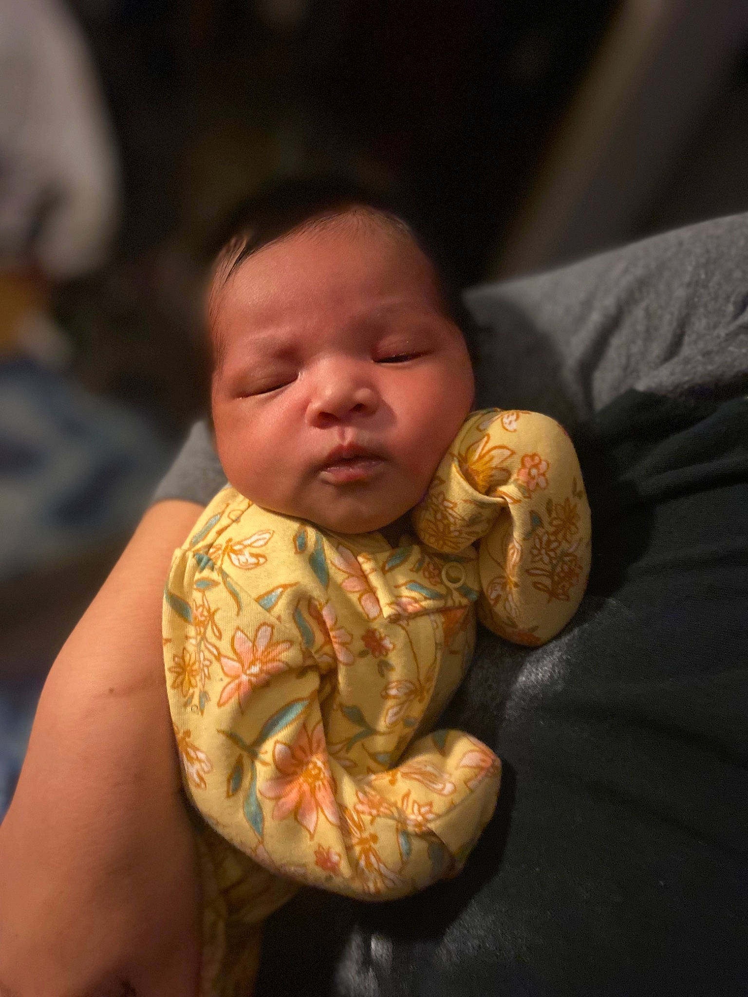 Leilani is registered to the contest to win money with this photo: abdomen, baby, baby_toddler_clothing, cheek, chest, child, comfort, darkness, elbow, flash_photography, gesture, happy, human_body, iris, neck, person, sitting, skin, sleeve, thumb