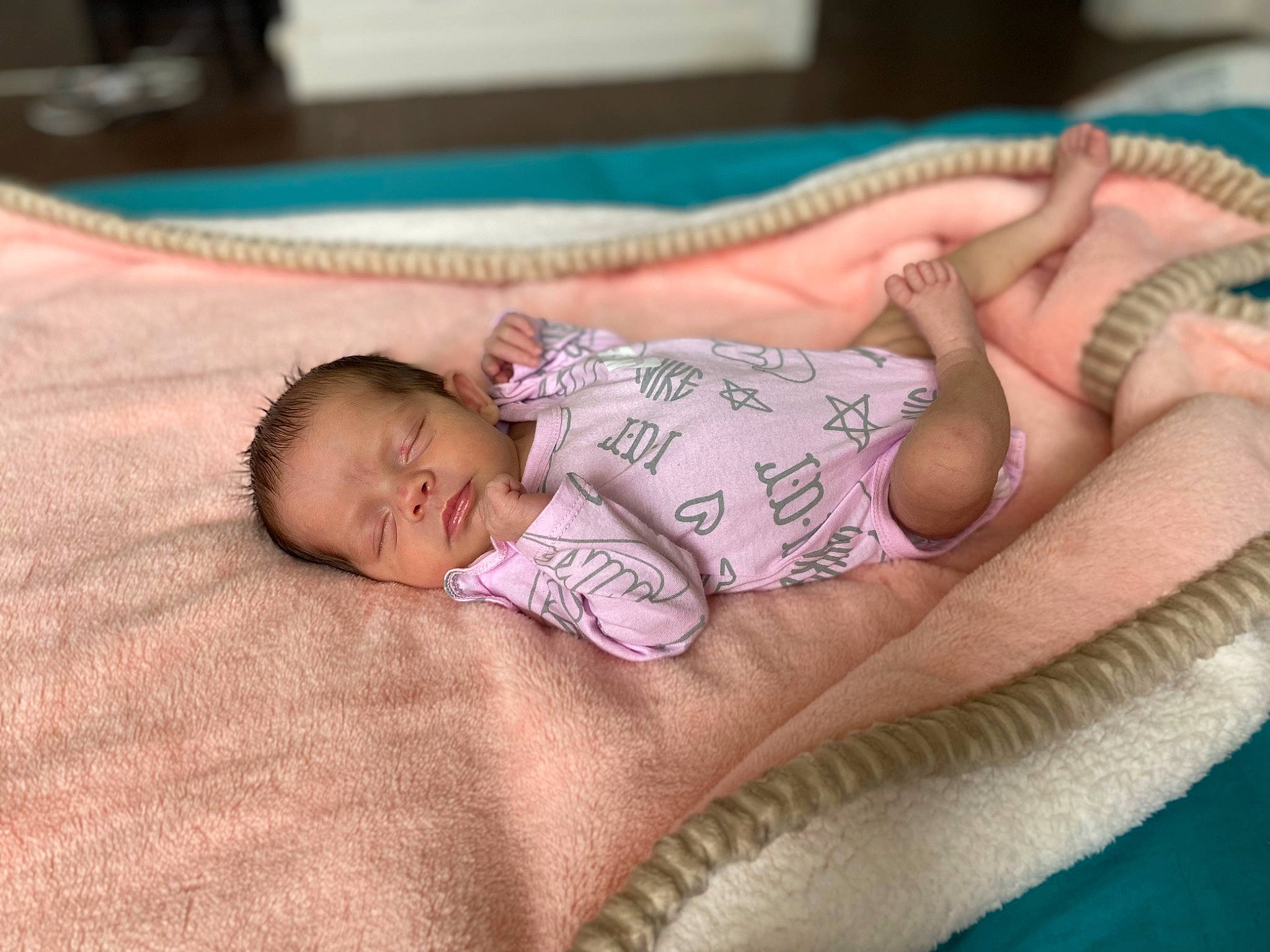 Kinsley joined the competition — help win amazing prizes! arm, baby, baby_toddler_clothing, cheek, child, comfort, eye, face, finger, hand, head, human_body, linens, mammal, pattern, person, product, skin, textile, toddler