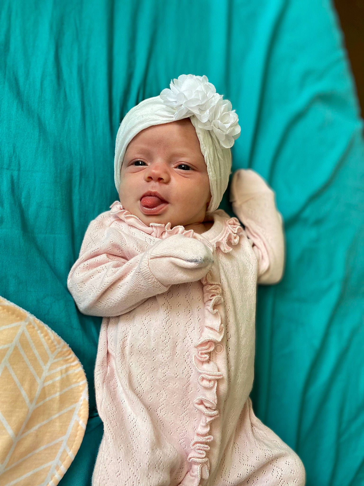 Kinsley joined the competition — help win amazing prizes! baby, baby_products, baby_sleeping, baby_toddler_clothing, cheek, child, comfort, event, face, grass, hat, headwear, linens, peach, person, portrait_photography, room, sitting, skin, sleeve