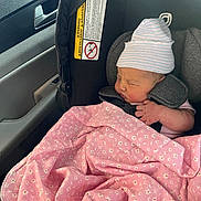 Rosalyn Jean joined the competition — help win amazing prizes! newborn, baby, car_seat, blanket, pink, hat, sleeping, infant, child, car_interior, seatbelt, portrait, clothing, indoors, peaceful, resting, cute, toddler, young_child, transportation