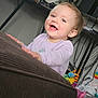 Omara is registered to the contest to win money with this photo: baby, child, childhood, couch, cute, expression, face, furniture, hair, happy, home, indoor, infant, person, playtime, portrait, purple_sweater, room, smiling, toys