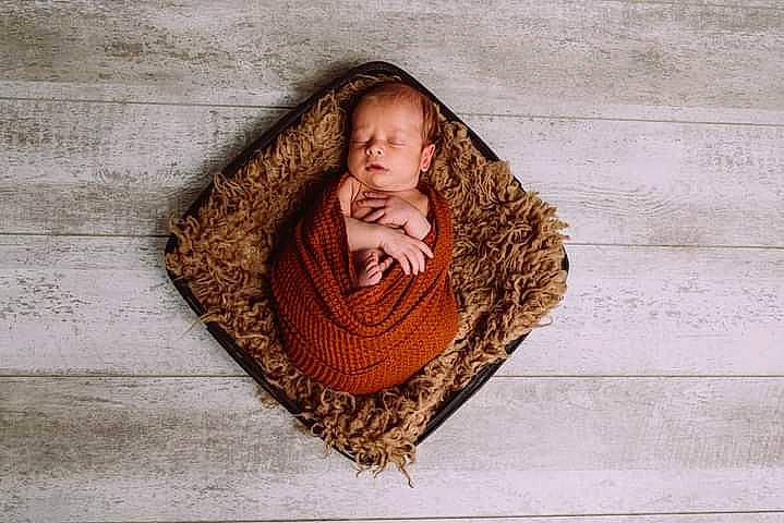 Malakai is registered to the contest to win money with this photo: art, beard, brick, child, circle, eye, facial_hair, fashion_accessory, flesh, flooring, fur, head, outerwear, pattern, person, portrait_photography, sitting, textile, visual_arts, wood