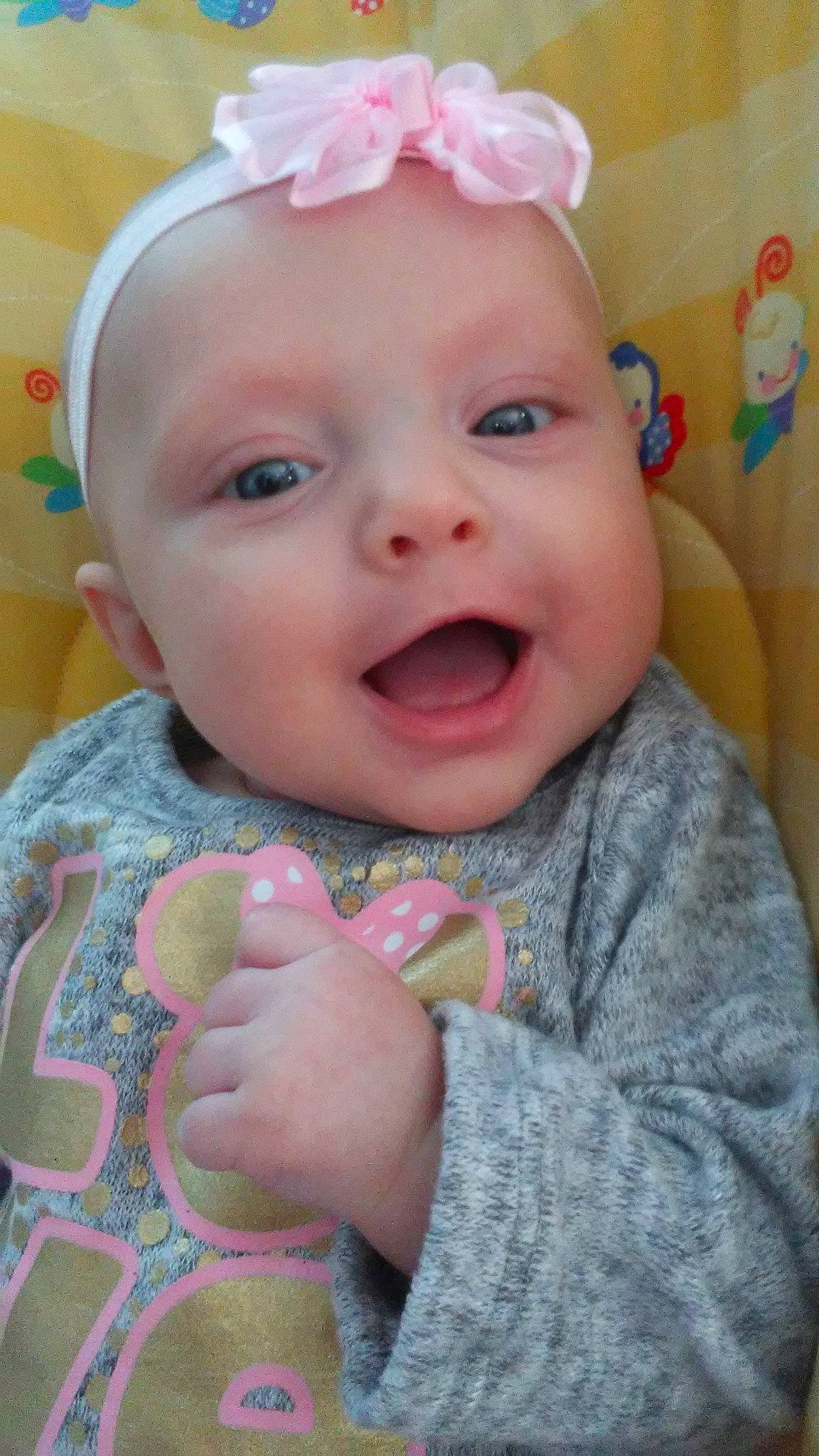 Anika joined the competition — help win amazing prizes! baby, baby_making_funny_faces, cheek, child, ear, eye, face, facial_expression, hair_accessory, head, iris, lip, mouth, nose, person, pink, skin, smile, toddler