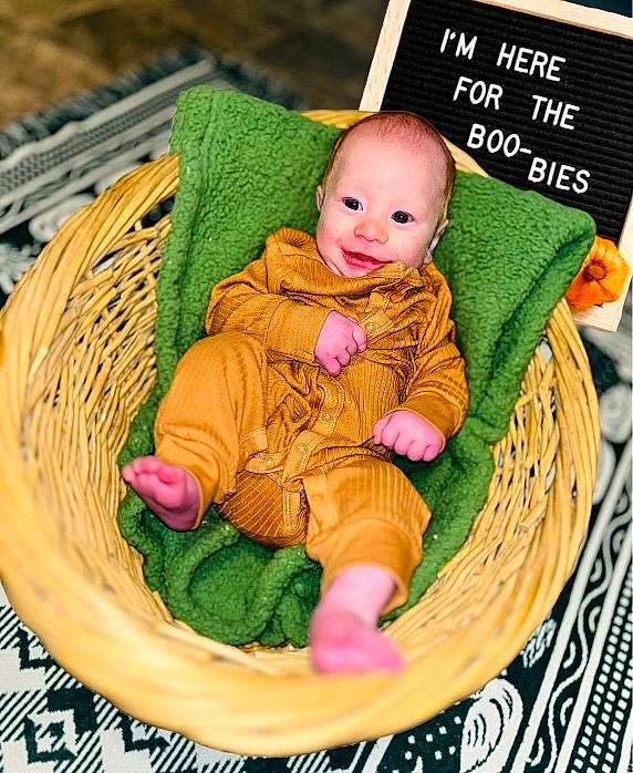 Weston is registered to the contest to win money with this photo: baby, baby_products, baby_toddler_clothing, basket, cheek, child, circle, dishware, grass, happy, holiday, linens, person, serveware, sitting, tableware, textile, toddler, wicker, wood