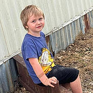 Lex joined the competition — help win amazing prizes! child, boy, outdoor, rust, metal, building, tshirt, shorts, grass, leaves, blue_eyes, blonde_hair, sitting, hand, footwear, smile, casual_clothing, nature, dirt, daylight