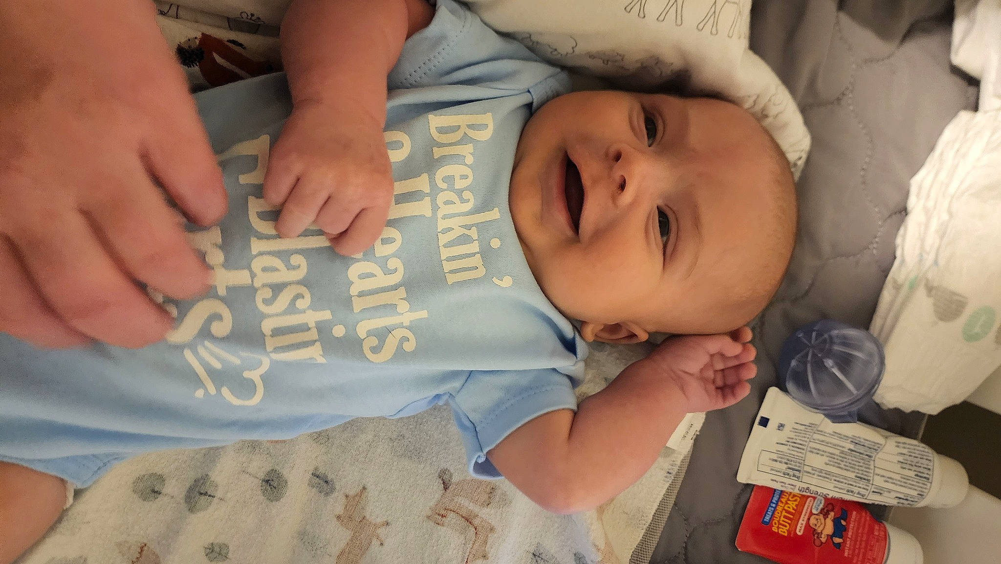 Pierson is registered to the contest to win money with this photo: arm, baby, baby_toddler_clothing, cheek, child, comfort, elbow, finger, font, hand, happy, mouth, nail, person, skin, sleeve, smile, thumb, toddler, tree