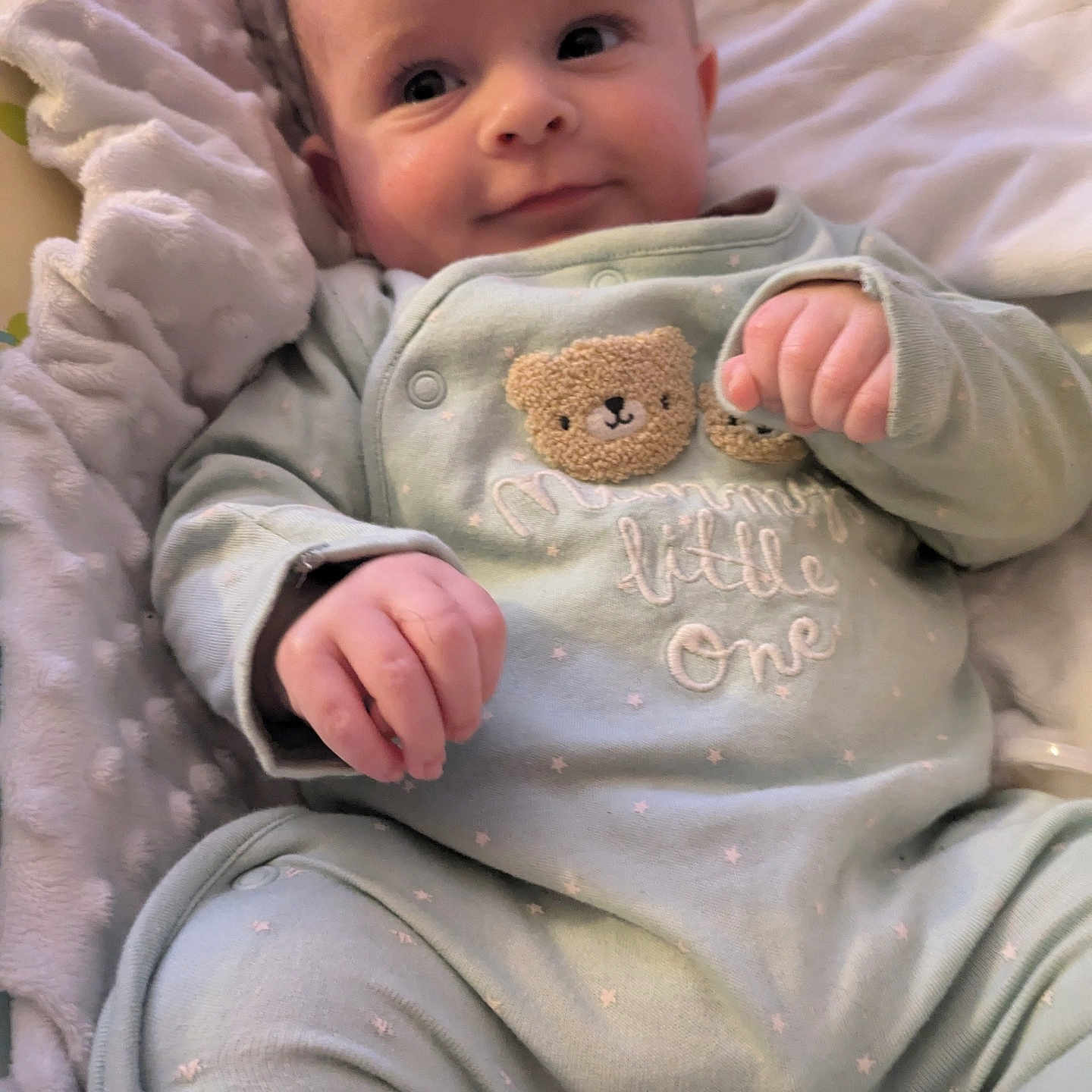 Oakley joined the competition — help win amazing prizes! baby, bed, blanket, bodypart, clothing, crib, face, finger, furniture, hand, head, newborn, pajamas, pants, person, photography, portrait, quilt, teddybear, toy
