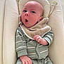 Noah a rejoint le concours — aidez-le/la à gagner de superbes lots ! baby, baby_seat, bib, child, comfort, cushion, cute, face, head_support, indoor, infant, newborn, pajamas, portrait, resting, skin, small_hands, striped_clothing, surprised_expression, young_child