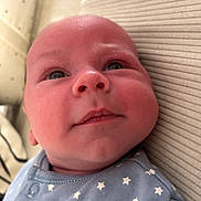 Noah participe au concours pour gagner de l'argent avec cette photo : baby, blue_clothing, child, closeup, comfortable, curious, cute, expression, face, head, indoors, infant, lying_down, newborn, portrait, resting, skin, soft_light, stars_pattern, young