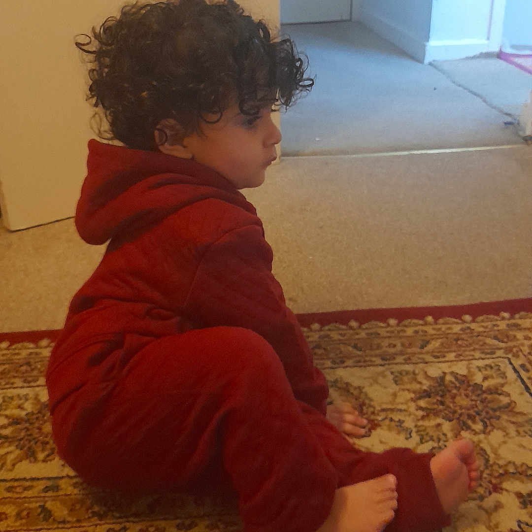 Muhammad joined the competition — help win amazing prizes! baby, back, bodypart, clothing, crawling, door, face, finger, hand, hardwood, head, homedecor, mat, pants, person, photography, portrait, sitting, velvet, wood