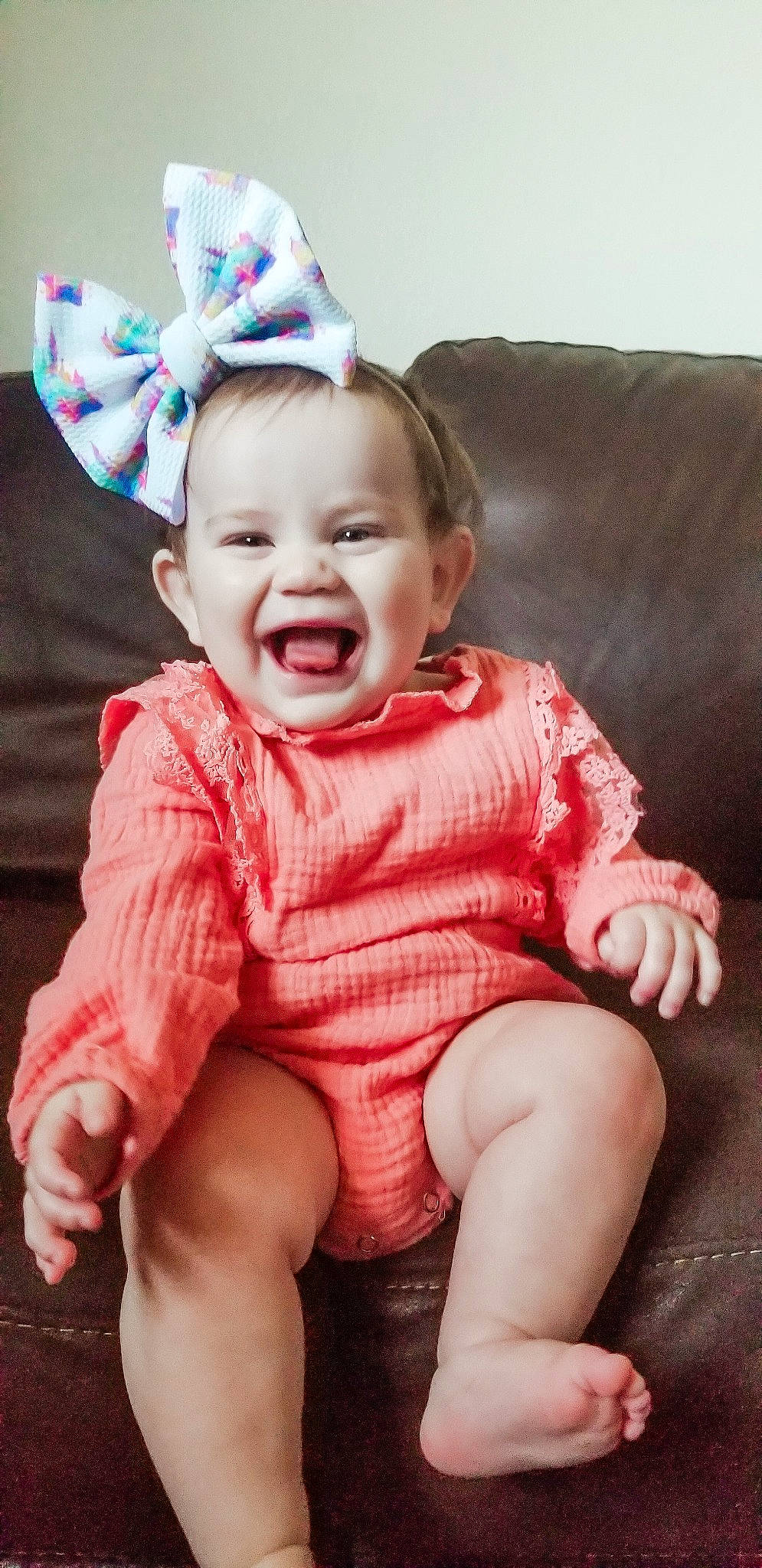 Averi is registered to the contest to win money with this photo: baby, baby_laughing, baby_making_funny_faces, baby_toddler_clothing, cheek, child, child_model, ear, facial_expression, fun, happy, headgear, laugh, lip, pattern, person, pink, sitting, skin, smile