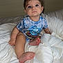 Alina joined the competition — help win amazing prizes! baby, child, blue_eyes, onesie, shark, tie_dye, bed, blanket, white_bedding, foot, hand, curly_hair, earrings, indoor, cute, portrait, infant, sitting, soft, cozy