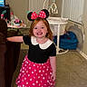 Mariah joined the competition — help win amazing prizes! child, girl, toddler, minnie_mouse, costume, polka_dot_dress, red_bow, smiling, happy, portrait, standing, barefoot, indoor, living_room, carpet, playpen, toys, chair, television, family_home