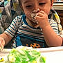 Robbie joined the competition — help win amazing prizes! toddler, child, cake, frosting, messy, high_chair, striped_shirt, kitchen, food, hand, face, eating, young_child, indoor, person, birthday_cake, colorful, happy, celebration, closeup