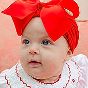 Novella joined the competition — help win amazing prizes! baby, infant, child, headband, red_bow, blue_eyes, white_dress, embroidery, portrait, closeup, cute, adorable, face, skin, young, fashion, accessory, soft_background, indoor, smiling