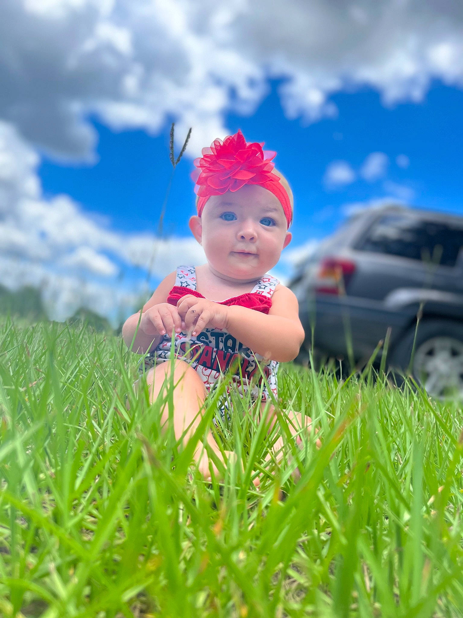 Rita joined the competition — help win amazing prizes! azure, baby, car, cloud, eye, face, facial_expression, flash_photography, fun, grass, grassland, happy, hat, headwear, people_in_nature, person, plant, skin, sky, tire