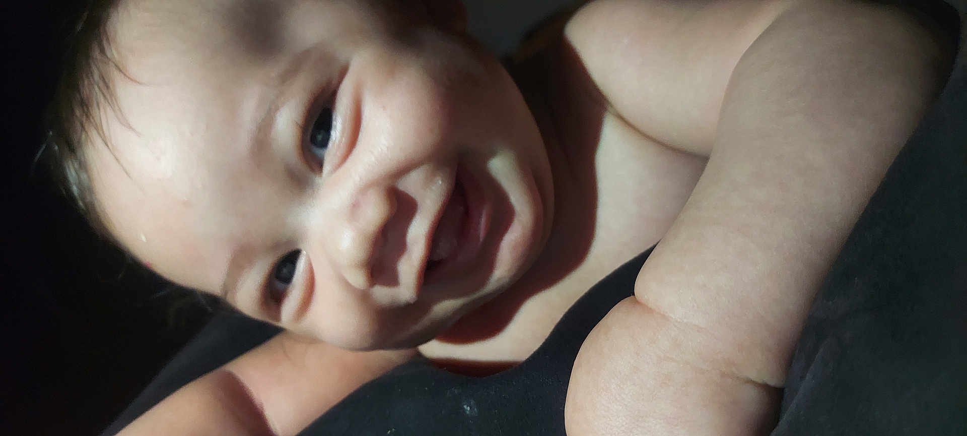 Angel is registered to the contest to win money with this photo: baby, smile, face, closeup, child, skin, arm, cheeks, infant, portrait, happy, cute, young, person, expression, natural_light, indoor, head, eyebrows, nostrils