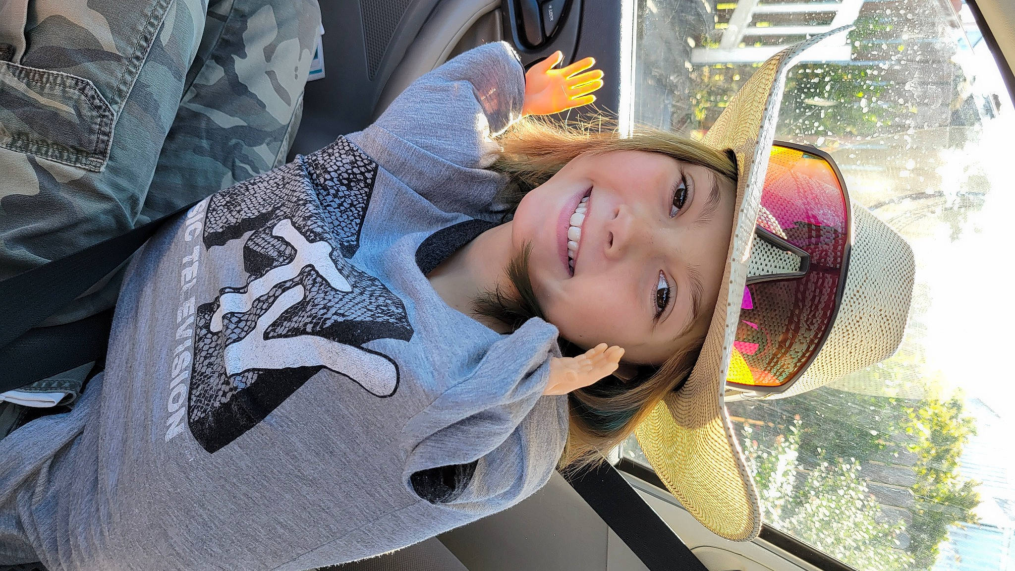 Braelynn is registered to the contest to win money with this photo: auto_part, automotive_design, automotive_wheel_system, black_hair, child, cool, eyewear, fashion_accessory, flash_photography, fun, happy, headgear, headwear, joy, leisure, luxury_vehicle, person, personal_protective_equipment, recreation, smile