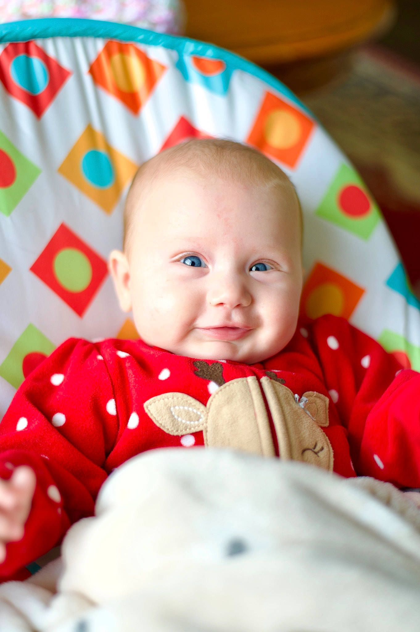 Anabella is registered to the contest to win money with this photo: baby, baby_toddler_clothing, carmine, cheek, child, comfort, event, eye, fictional_character, happy, head, laugh, linens, pattern, person, portrait_photography, sitting, sleeve, smile, sweetness