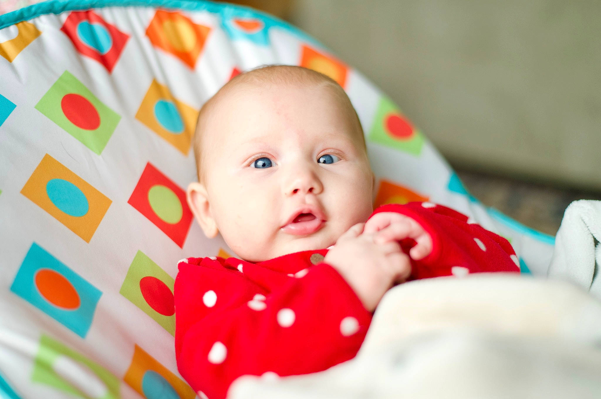 Anabella is registered to the contest to win money with this photo: baby, baby_products, baby_toddler_clothing, cheek, child, comfort, event, eye, face, fun, happy, head, iris, linens, pattern, person, portrait_photography, room, sitting, smile