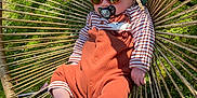 Paul participe au concours pour gagner de l'argent avec cette photo : baby, child, sunglasses, hat, pacifier, outdoor, grass, hammock, woven_chair, relaxing, sunny, foot, clothing, cute, infant, one_person, summer, nature, leisure, baby_clothes