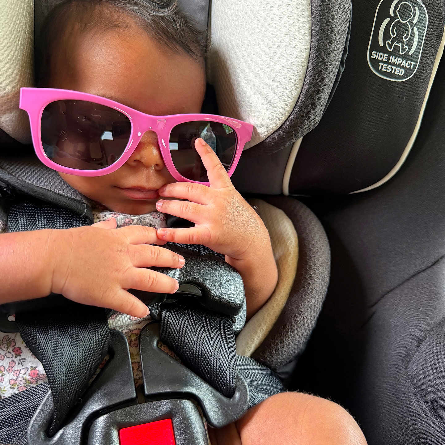 Serenity joined the competition — help win amazing prizes! baby, sunglasses, car_seat, child, infant, hands, safety_harness, pink, cool, cute, seatbelt, closeup, portrait, fashion, accessory, relaxing, young, person, expression, indoor