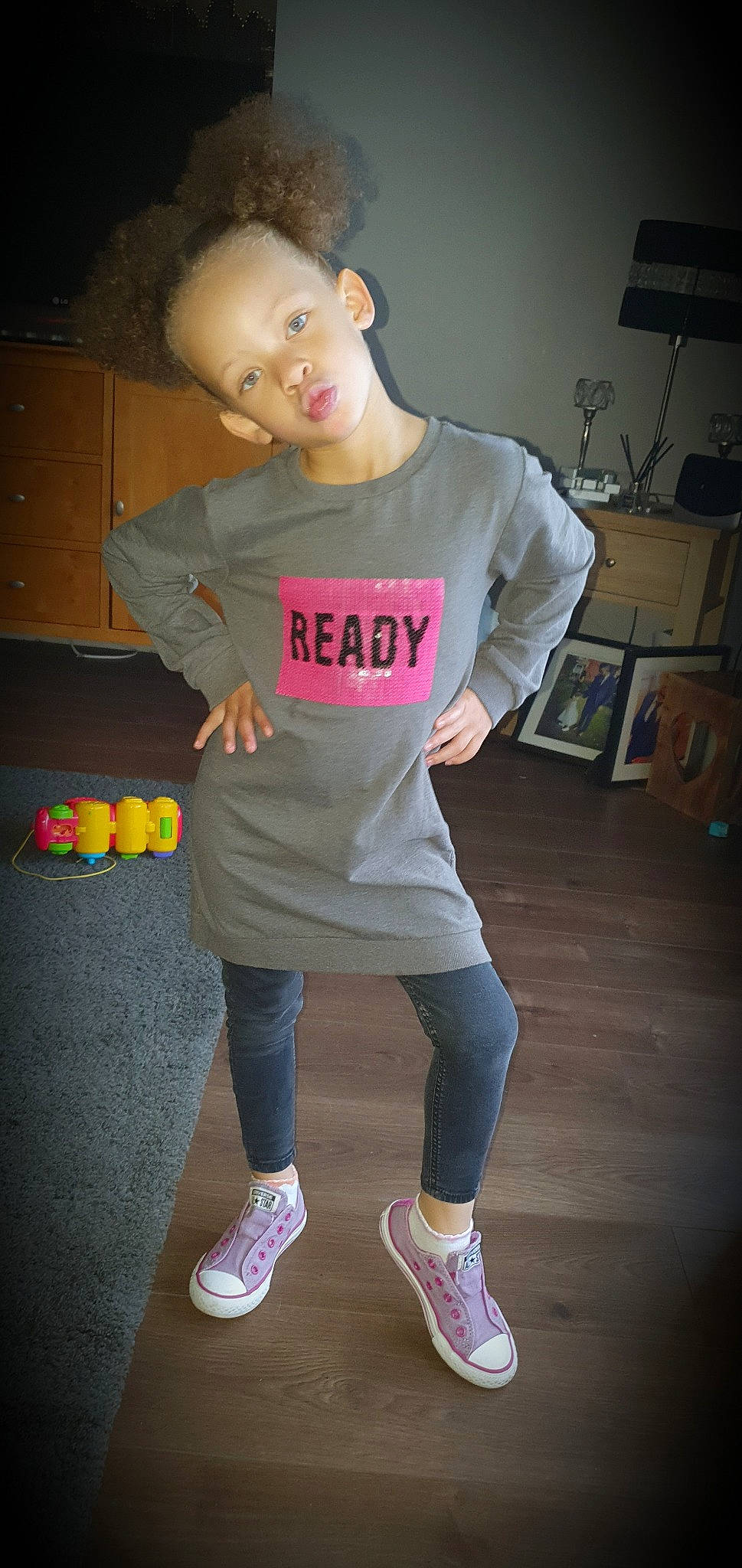 Esmee is registered to the contest to win money with this photo: child, clothing, cool, footwear, fun, joint, knee, person, pink, shoe, shoulder, sleeve, standing, t_shirt, top