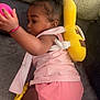 Lhayanna participe au concours pour gagner de l'argent avec cette photo : baby, infant, crawling, pink_clothing, ball, backpack, yellow, banana_shaped, carpet, pillow, couch, indoor, child, cute, soft_texture, playful, toy, skin, hair, earrings