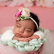 Noor joined the competition — help win amazing prizes! adorable, baby, child, closeup, cozy, cute, face, flower_headband, hands, infant, knitted_blanket, newborn, peaceful, peaceful_sleep, pink_background, portrait, resting, sleeping, soft_lighting, warm_colors