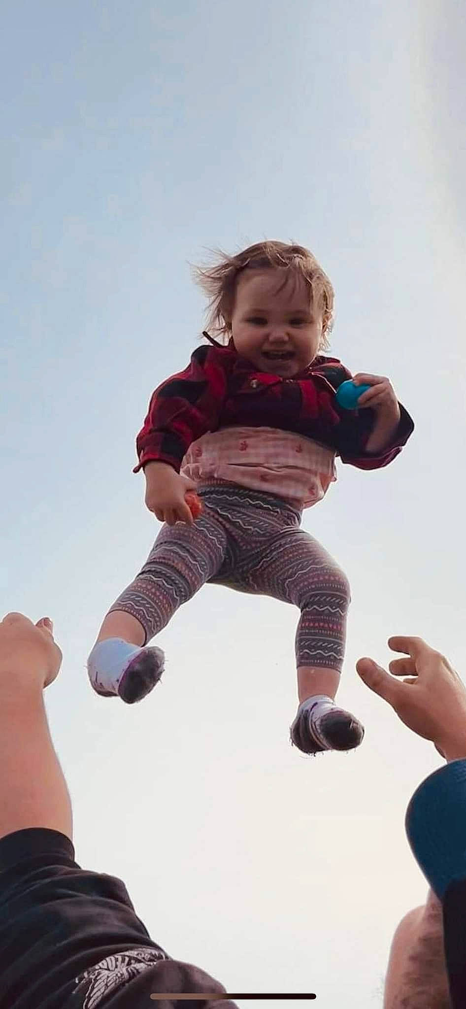 Novalynn is registered to the contest to win money with this photo: baby, baby_toddler_clothing, child, finger, fun, gesture, hand, happy, human, joint, leisure, people_in_nature, person, playing_with_kids, recreation, sky, sleeve, smile, standing, thumb