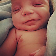 Kolter Xavier joined the competition — help win amazing prizes! baby, sleeping, smile, closeup, blanket, infant, skin, peaceful, soft, cute, child, newborn, hand, resting, wrapped, face, portrait, relaxed, comfort, toddler