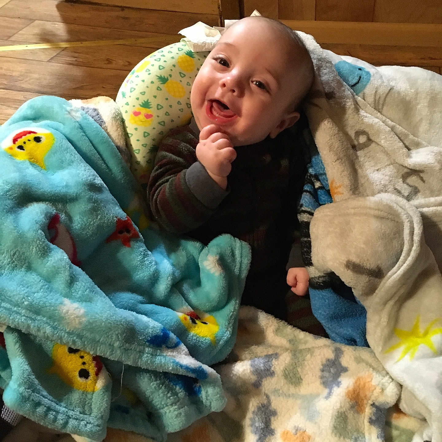Skylo joined the competition — help win amazing prizes! baby, blanket, child, cozy, colorful, floor, furniture, happy, indoors, infant, joyful, person, plush, portrait, smile, soft, warm, wood, young, cute