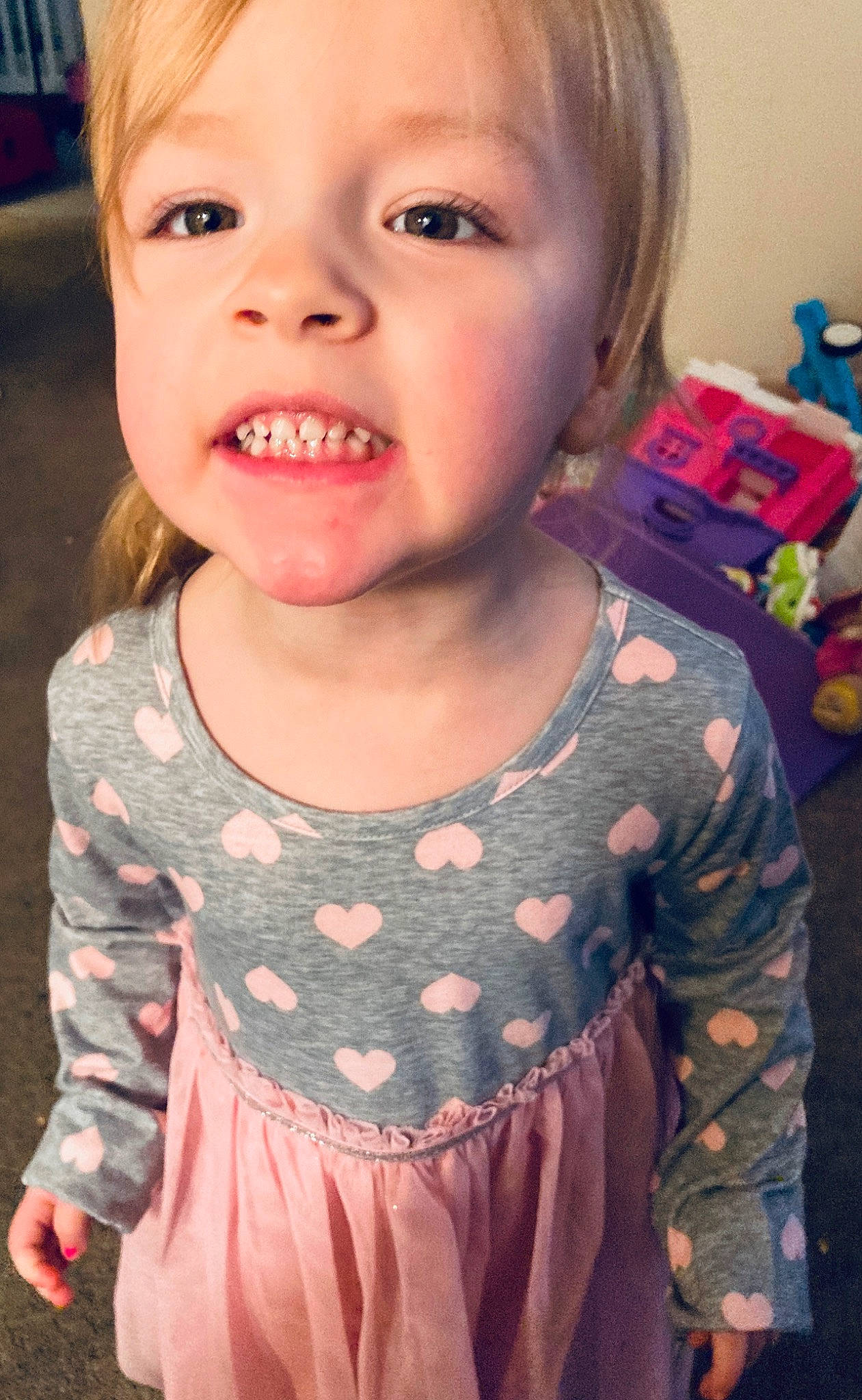 Addyson is registered to the contest to win money with this photo: cheek, child, face, facial_expression, head, lip, mouth, nose, organ, person, skin, sleeve, smile, toddler, tongue, tooth