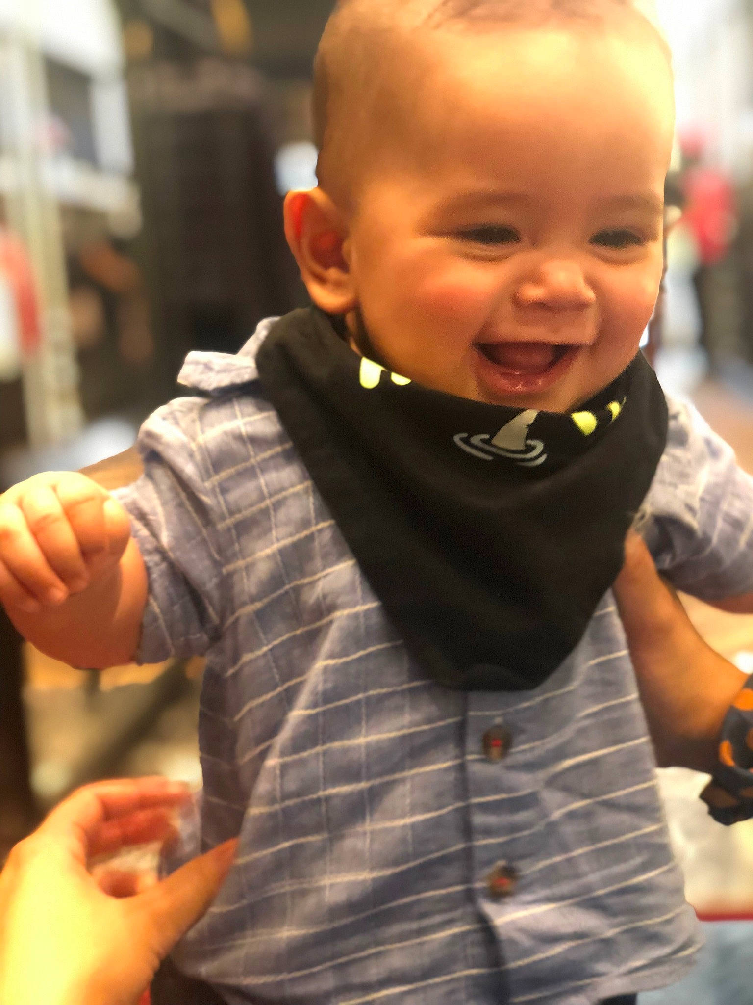 Tanner is registered to the contest to win money with this photo: baby_toddler_clothing, beard, cheek, child, collar, dress_shirt, eyewear, face, facial_expression, finger, gesture, hand, happy, human, orange, person, skin, sleeve, smile, thumb