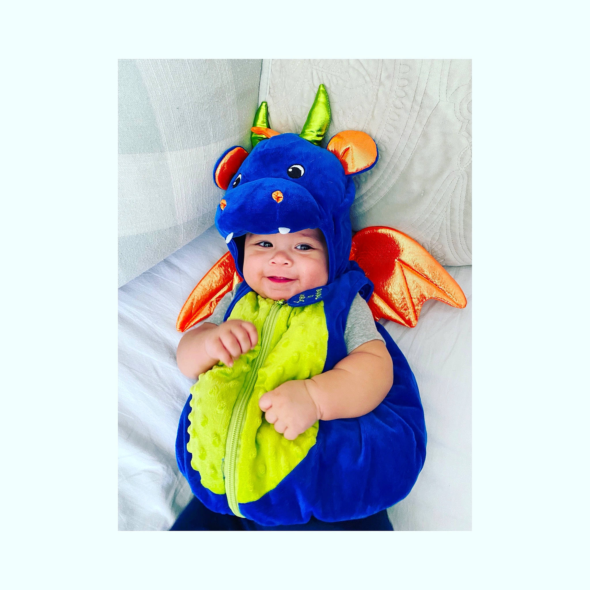 Tanner is registered to the contest to win money with this photo: baby, baby_products, baby_toddler_clothing, baby_toys, beanie, cap, costume, costume_accessory, electric_blue, fashion_accessory, fun, gesture, happy, headgear, headwear, person, personal_protective_equipment, play, sleeve, smile