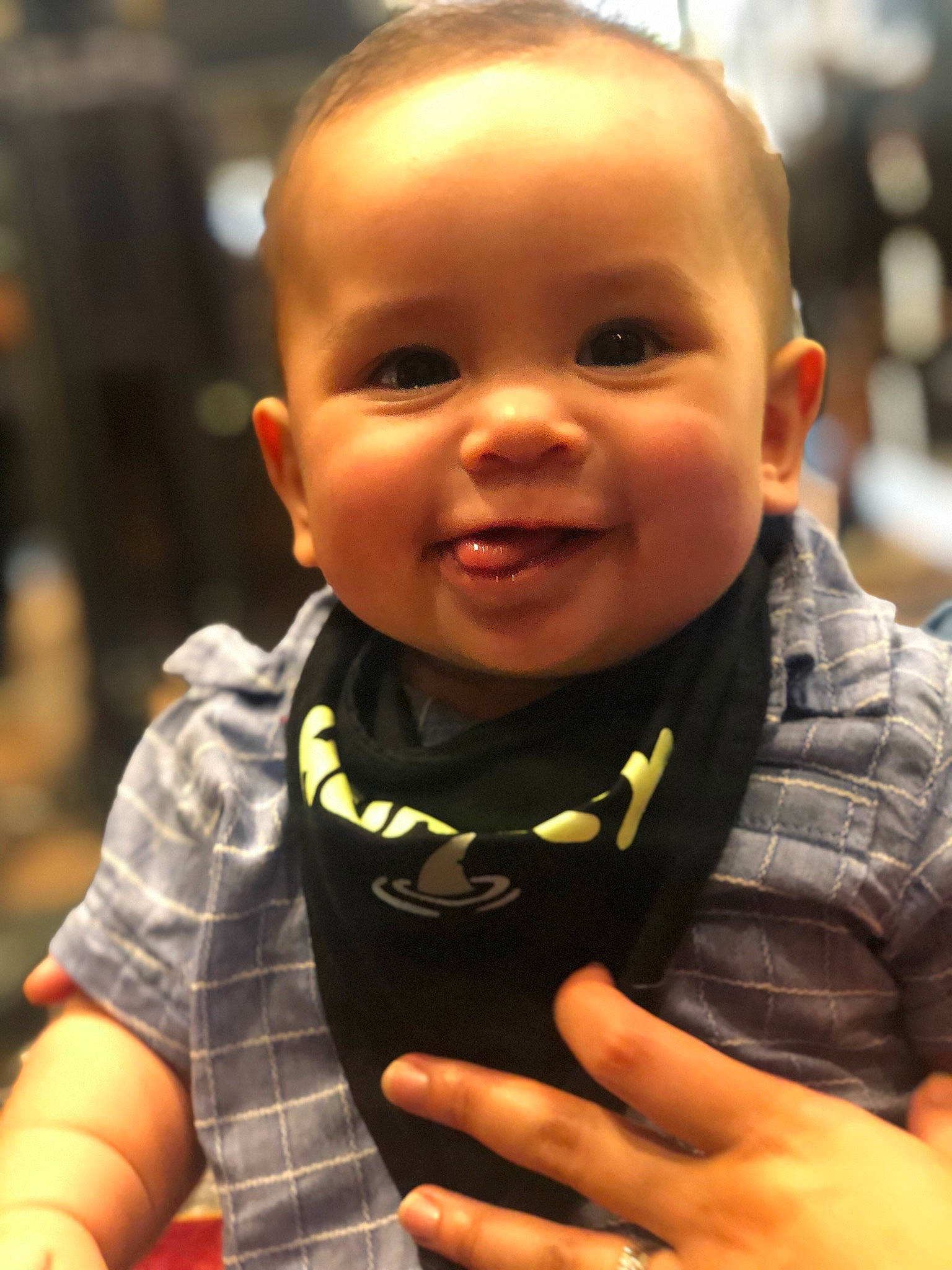 Tanner is registered to the contest to win money with this photo: baby, baby_toddler_clothing, cheek, chin, cool, eye, eyebrow, finger, gesture, hand, happy, head, iris, joy, lip, nose, orange, person, skin, smile