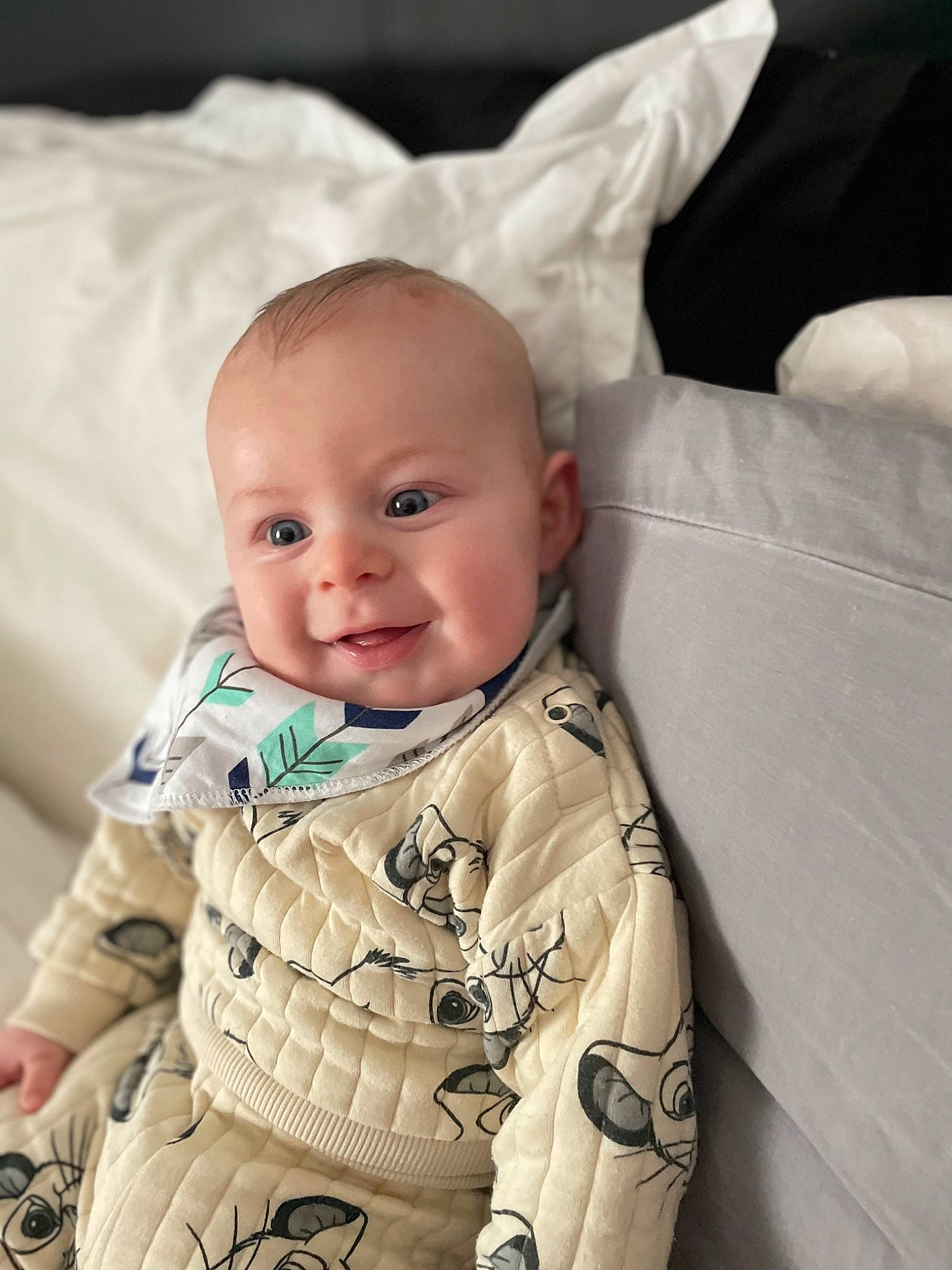 James is registered to the contest to win money with this photo: baby, baby_toddler_clothing, cheek, child, comfort, eye, eyebrow, face, facial_expression, finger, happy, head, iris, person, product, skin, sleeve, smile, textile, toddler