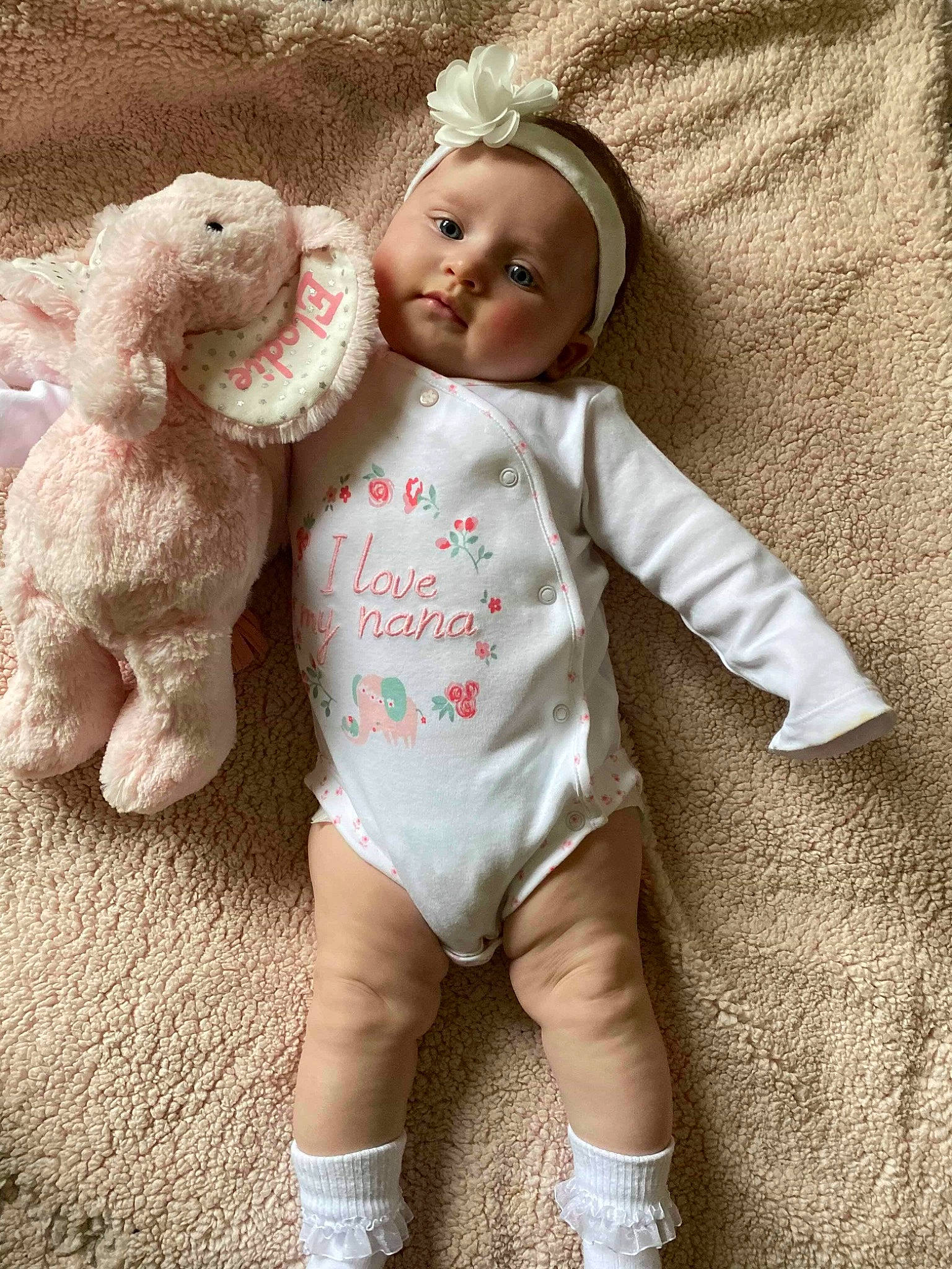 Elodie joined the competition — help win amazing prizes! baby, baby_products, baby_toddler_clothing, beige, blond, brown_hair, cheek, child, doll, ear, outerwear, pattern, person, pink, product, skin, stuffed_toy, toddler, toy