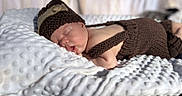 Kaine joined the competition — help win amazing prizes! baby, blanket, clothing, face, hat, head, infantbed, newborn, person, sleeping