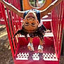 Molli joined the competition — help win amazing prizes! child, playground, upside_down, smiling, face_paint, curly_hair, braids, red_equipment, outdoor, sunlight, happy, play, steps, shoes, fun, person, summer, recreation, joy, active