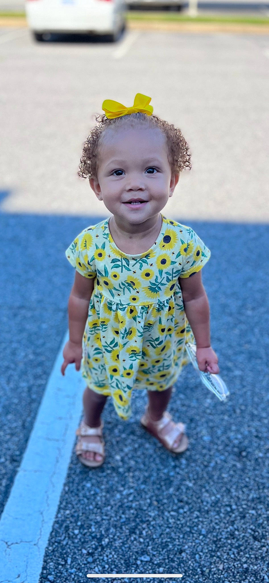 Laylah is registered to the contest to win money with this photo: baby_toddler_clothing, beauty, blue, child, eye, face, footwear, fun, grass, happy, head, headgear, joy, people, people_in_nature, person, skin, sleeve, smile, standing