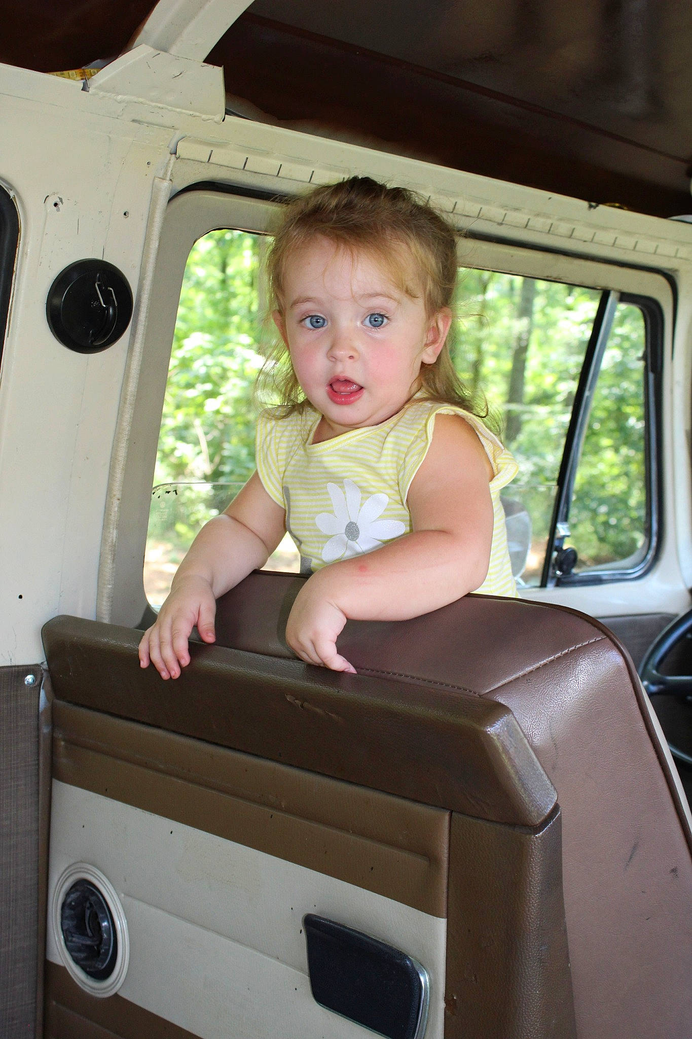 Kyndall is registered to the contest to win money with this photo: auto_part, car, child, person, surprise, toddler, vacation, vehicle