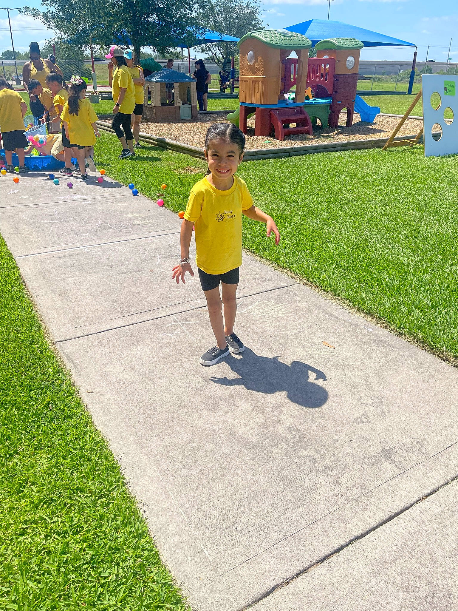 Nori joined the competition — help win amazing prizes! asphalt, city, fun, grass, joy, landscape, lawn, leisure, outdoor_play_equipment, outdoor_recreation, person, plant, play, pole, recreation, road, road_surface, shorts, sidewalk, sky