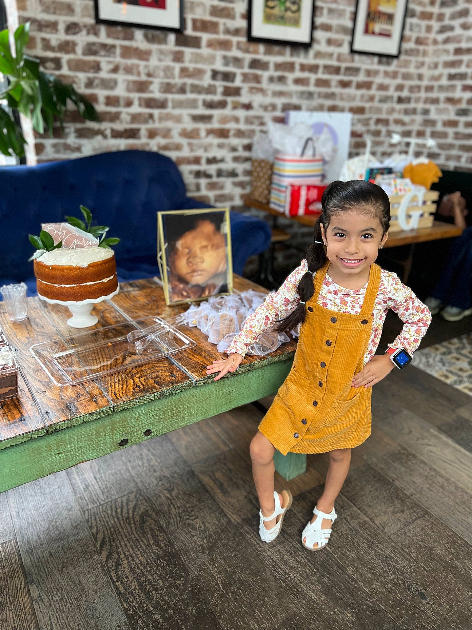 Nori joined the competition — help win amazing prizes! baby, brick, brickwork, child, flooring, fun, happy, houseplant, joy, leisure, orange, person, picture_frame, plant, road, sandal, sitting, smile, table, toddler
